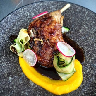 Confit five spiced duck leg with orange and carrot puree and tamarind caramel