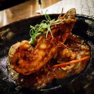 Bug tail pan fried in a seafood spice paste with baby corn and spring onion